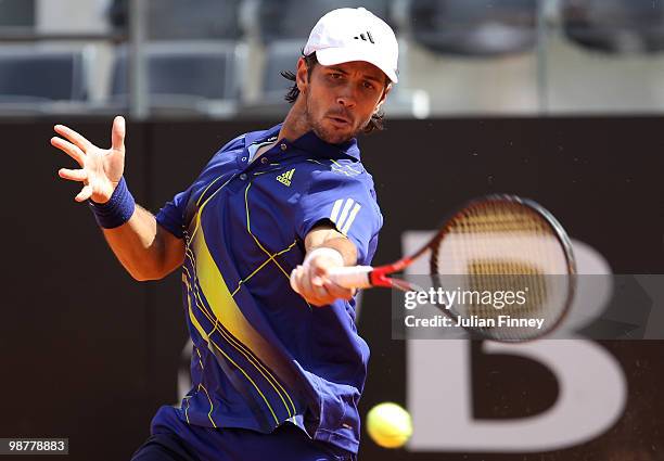 Fernando Verdasco of Spain plays a forehand in his match against David Ferrer of Spain plays a backhand in his match against during day seven of the...