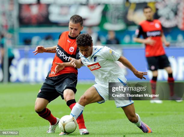 Benjamin Koehler of Frankfurt battles for the ball with Carlos Eduardo of Hoffenheim during the Bundesliga match between Eintracht Frankfurt and TSG...