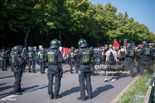 Police stand guard at a demonstration against the right-wing Alternative for Germany political party federal congress on June 30, 2018 in Augsburg,...