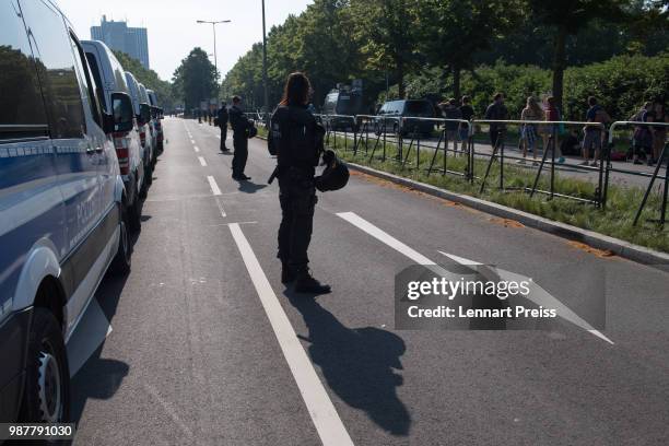 Police stand guard at the Augsburg Convention Center, venue of the right-wing Alternative for Germany political party federal congress, on June 30,...