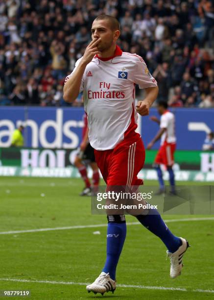 Mladen Petric of Hamburg celebrates after scoring his team's third goal during the Bundesliga match between Hamburger SV and 1. FC Nuernberg at HSH...