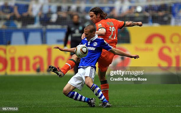 Peer Kluge of Schalke and Torsten Frings of Bremen battle for the ball during the Bundesliga match between FC Schalke 04 and Werder Bremen at Veltins...