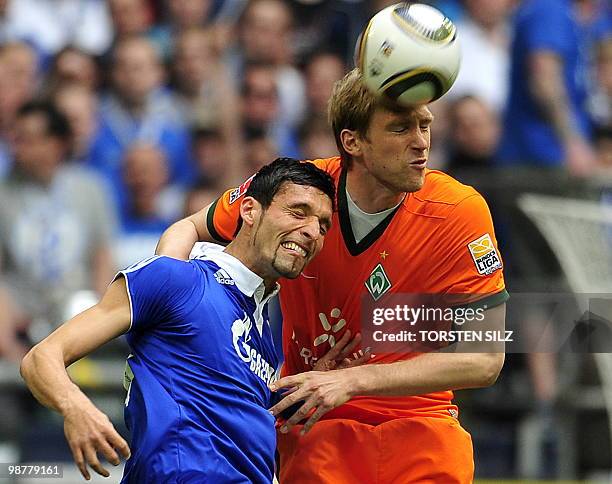 Schalke's striker Kevin Kuranyi and Werder Bremen's defender Per Mertesacker vie for the ball during the German first division Bundesliga football...