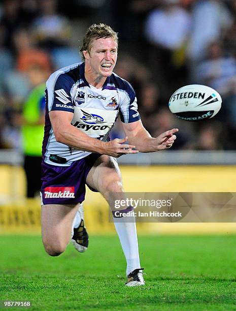 Brett Finch of the Storm passes the ball during the round eight NRL match between the North Queensland Cowboys and the Melbourne Storm at Dairy...