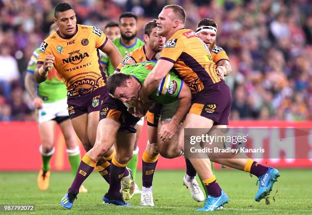 Shannon Boyd of the Raiders takes on the defence during the round 16 NRL match between the Brisbane Broncos and the Canberra Raiders at Suncorp...