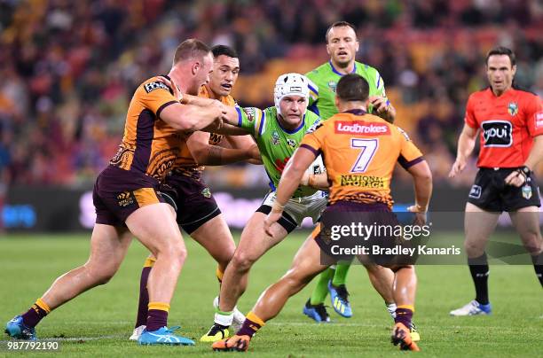 Jarrod Croker of the Raiders attempts to break away from the defence during the round 16 NRL match between the Brisbane Broncos and the Canberra...