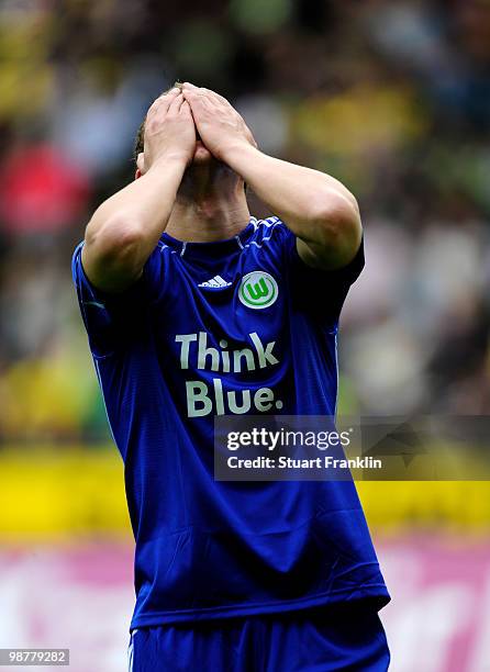 Edin Dzeko of Wolfsburg reacts to a missed chance during the Bundesliga match between Borussia Dortmund and VfL Wolfsburg at Signal Iduna Park on May...