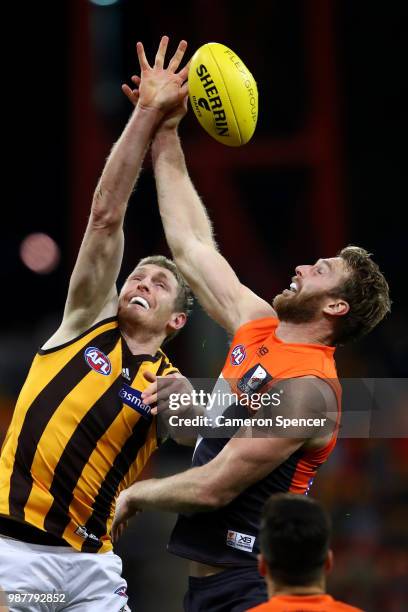 Ben McEvoy of the Hawks and Dawson Simpson of the Giants contest the ball during the round 15 AFL match between the Greater Western Sydney Giants and...