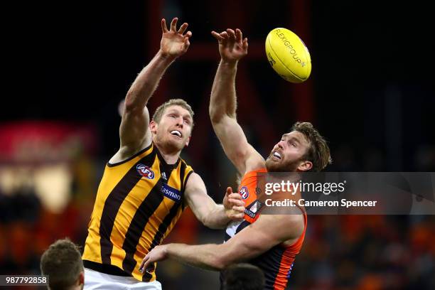 Ben McEvoy of the Hawks and Dawson Simpson of the Giants contest the ball during the round 15 AFL match between the Greater Western Sydney Giants and...