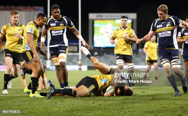 Julian Savea of the Hurricanes scores a try during the round 17 Super Rugby match between the Brumbies and the Hurricanes at GIO Stadium on June 30,...