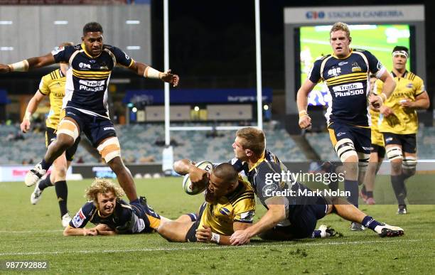 Julian Savea of the Hurricanes scores a try during the round 17 Super Rugby match between the Brumbies and the Hurricanes at GIO Stadium on June 30,...