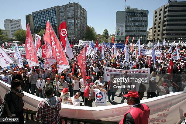 Tens of thousands of Turkish workers hold banners and flags as they gather to celebrate May Day in the Turkish capital, Ankara on May 1, 2010. The...