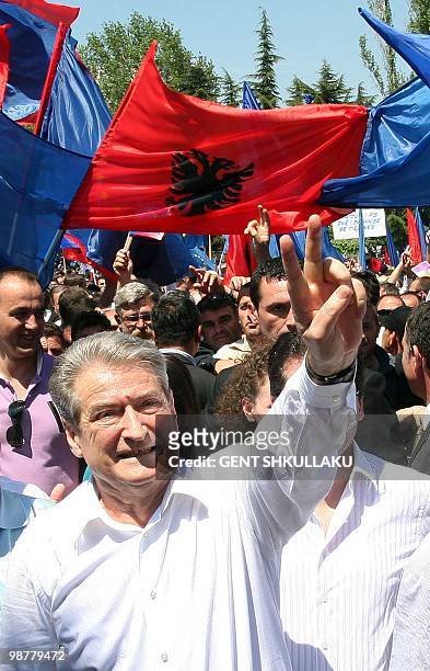 Albania's Prime Minister Sali Berisha waves to his supporters during celebrations marking Labor Day in Tirana on May 1, 2010. Thousands of opposition...