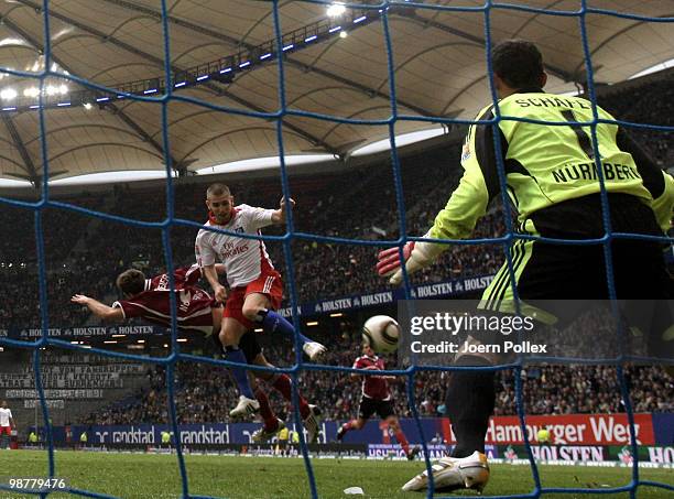 Mladen Petric of Hamburg scores his team's third goal during the Bundesliga match between Hamburger SV and 1. FC Nuernberg at HSH Nordbank Arena on...