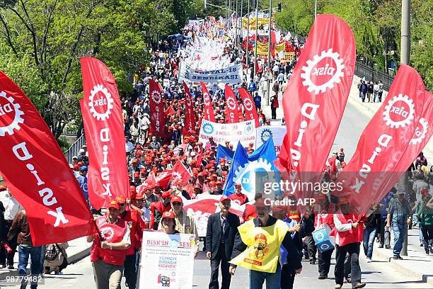 Tens of thousands of Turkish workers hold banners and flags as they gather to celebrate May Day in the Turkish capital, Ankara on May 1, 2010. The...