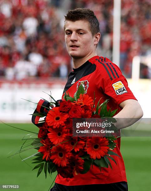 Toni Kroos of Leverkusen receives flowers before the Bundesliga match between Bayer Leverkusen and Hertha BSC Berlin at the BayArena on May 1, 2010...