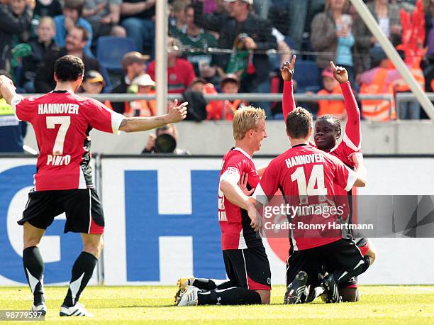 Didier Ya Konan, Hanno Balitsch, Mike Hanke and Sergio Pinto of Hannover celebrate their teams third goal during the Bundesliga match between...