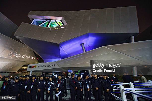 Chinese policemen stand guard after the Germany Pavilion closed on the opening day of the Shanghai World Expo on May 1, 2010 in Shanghai, China....