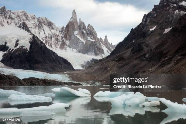 lake below cerro torre in winter, los glaciares national park, santa cruz province, argentina - lake argentina stockfoto's en -beelden