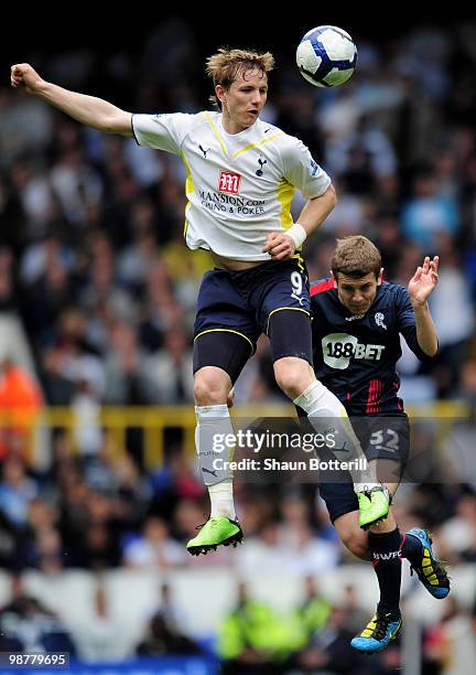 Roman Pavlyuchenko of Tottenham Hotspur is challeged by Jack Wilshere of Bolton Wanderers during the Barclays Premier League match between Tottenham...