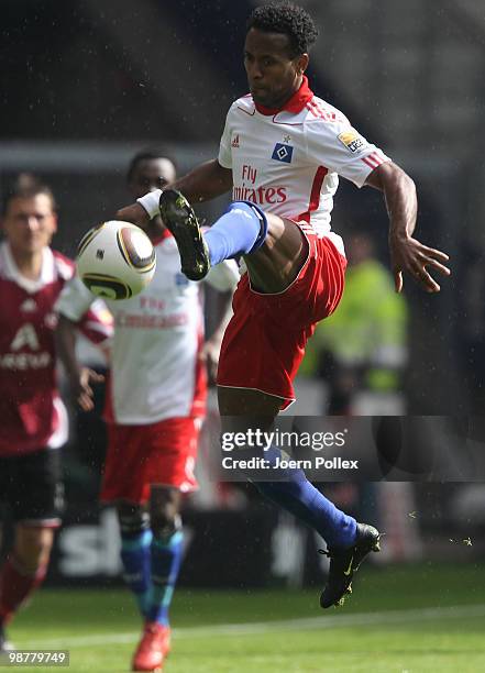 Ze Roberto of Hamburg kicks the ball during the Bundesliga match between Hamburger SV and 1. FC Nuernberg at HSH Nordbank Arena on May 1, 2010 in...