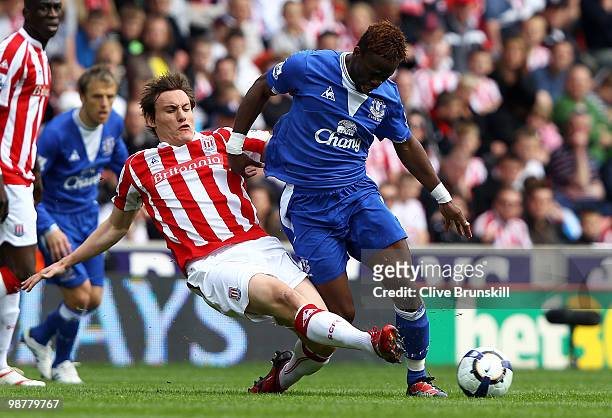 Louis Saha of Everton is tackled by Dean Whitehead of Stoke City during the Barclays Premier League match between Stoke City and Everton at Britannia...