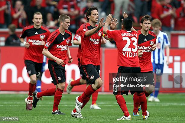 Manuel Friedrich of Leverkusen celebrates his team's first goal with team mates during the Bundesliga match between Bayer Leverkusen and Hertha BSC...