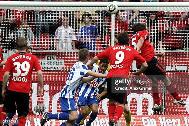 Manuel Friedrich of Leverkusen scores his team's first goal during the Bundesliga match between Bayer Leverkusen and Hertha BSC Berlin at the...