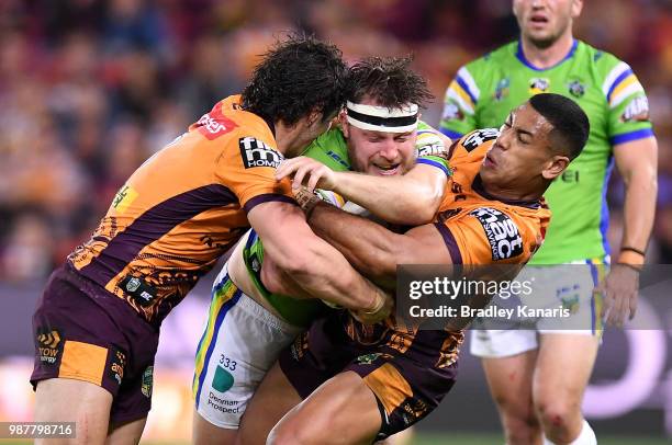 Elliott Whitehead of the Raiders is tackled during the round 16 NRL match between the Brisbane Broncos and the Canberra Raiders at Suncorp Stadium on...