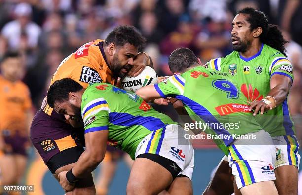 Sam Thaiday of the Broncos is met by the defence during the round 16 NRL match between the Brisbane Broncos and the Canberra Raiders at Suncorp...