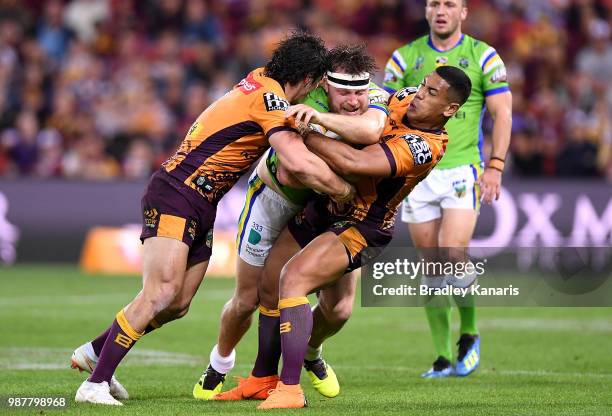 Elliott Whitehead of the Raiders is tackled during the round 16 NRL match between the Brisbane Broncos and the Canberra Raiders at Suncorp Stadium on...