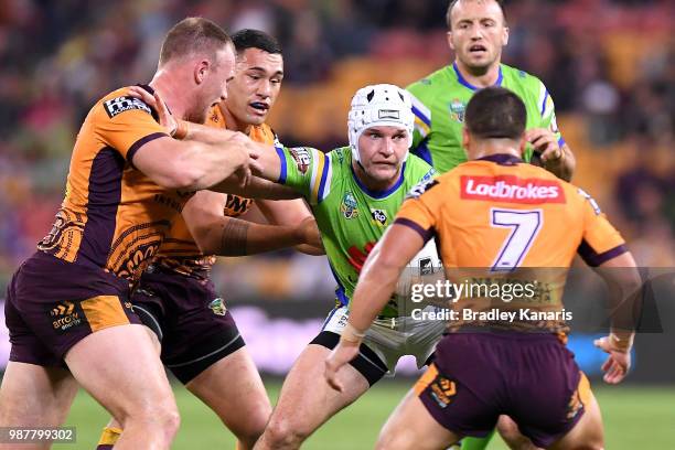 Jarrod Croker of the Raiders attempts to break away from the defence during the round 16 NRL match between the Brisbane Broncos and the Canberra...