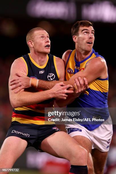 Scott Lycett of the Eagles competes with Sam Jacobs of the Crows during the 2018 AFL round15 match between the Adelaide Crows and the West Coast...