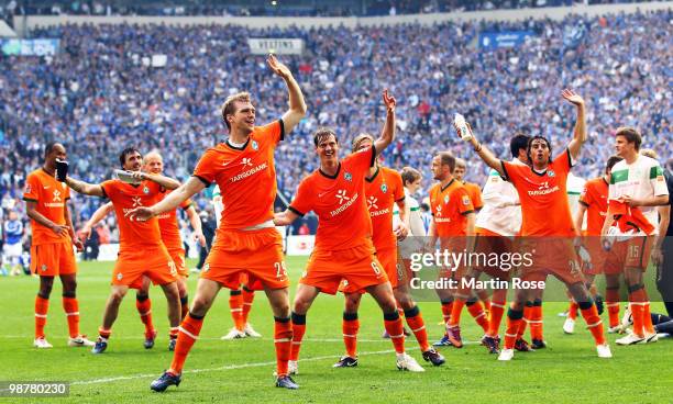 Per Mertesacker, Tim Borowski and Claudio Pizarro of Bremen celebrate after the Bundesliga match between FC Schalke 04 and Werder Bremen at Veltins...