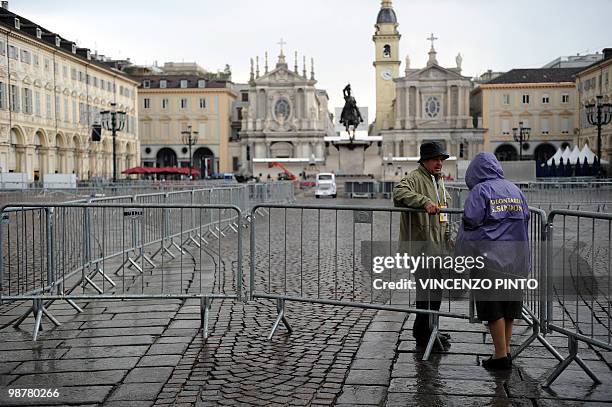 Shroud volunteers control the gate of the San Carlo square in central Turin on May 1, 2010. Pope Benedict XVI will bow, on May 2, before the Shroud...