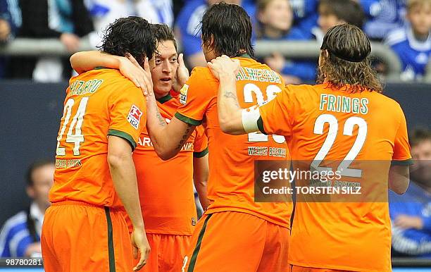 Werder Bremen's midfielder Mesut Oezil celebrates scoring with Werder Bremen's Peruvian striker Claudio Pizarro , Werder Bremen's Portugese striker...