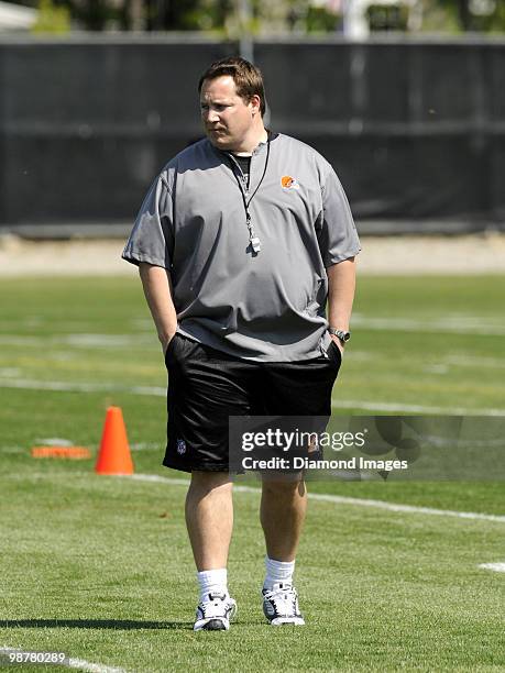 Head coach Eric Mangini of the Cleveland Browns watches players go through drills during the team's rookie and free agent mini camp on April 30, 2010...