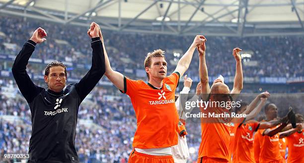 Tim Wiese, Per Mertesacker and Petri Pasanen of Bremen celebrate after the Bundesliga match between FC Schalke 04 and Werder Bremen at Veltins Arena...