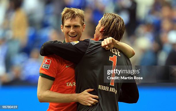 Tim Wiese , goalkeeper of Bremen celebrates with team mate Per Mertesacker after the Bundesliga match between FC Schalke 04 and Werder Bremen at...