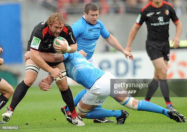 Toulouse's lock Romain millo-chlusky is tackled by Leinster's Leo Cullen during their European cup rugby union semi-final match Toulouse vs Leinster,...