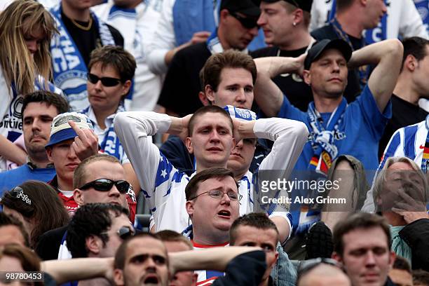 Supporters of Berlin react after the Bundesliga match between Bayer Leverkusen and Hertha BSC Berlin at the BayArena on May 1, 2010 in Leverkusen,...