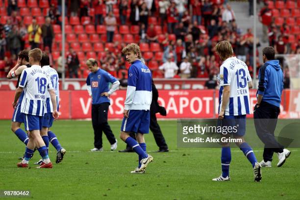 Head coach Friedhelm Funkel and players of Berlin leave the pitch after loosing the Bundesliga match between Bayer Leverkusen and Hertha BSC Berlin...