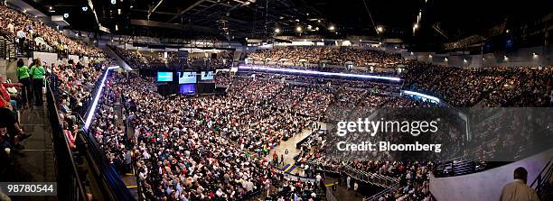 In this seven image composite, shareholders gather prior to the start of the Berkshire Hathaway annual meeting in Omaha, Nebraska, U.S., on Saturday,...