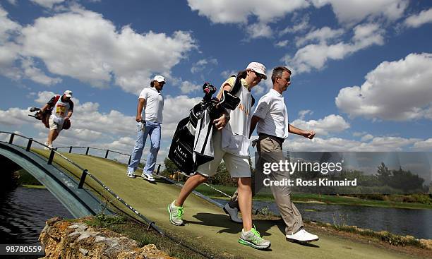 Mark Foster of England and his caddie Janet Squire make their way down the 18th fairway during the third round of the Open de Espana at the Real Club...