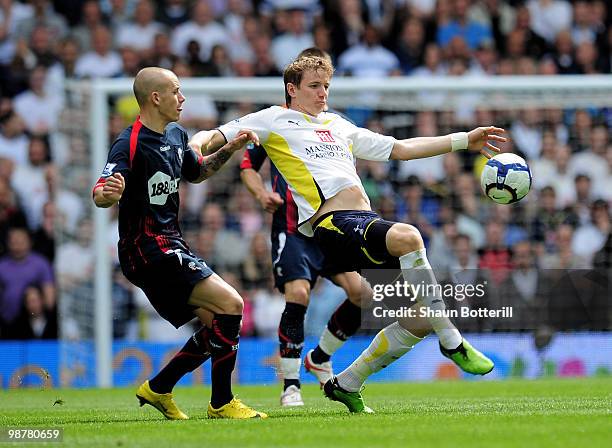 Roman Pavlyuchenko of Tottenham Hotspur is challenged by Vladimir Weiss of Bolton Wanderers during the Barclays Premier League match between...