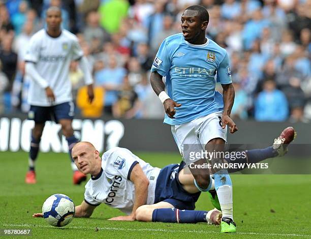 Manchester City's English midfielder Shaun Wright-Phillips skips past Aston Villa's Welsh defender James Collins during the English Premier League...