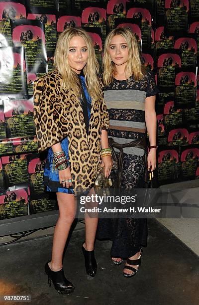 Actors Mary-Kate Olsen and Ashley Olsen attend Art of Elysium "Bright Lights" with VERSUS by Donatella Versace and Christopher Kane at Milk Studios...