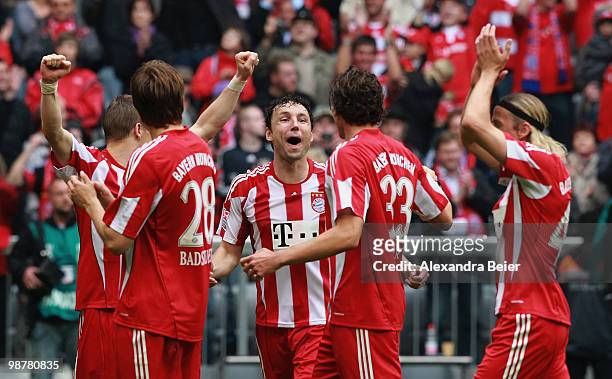 Bastian Schweinsteiger, Holger Badstuber, Mark van Bommel, Mario Gomez and Anatoliy Tymoshchuk of Bayern Muenchen celebrate their 3-1 victory after...