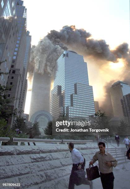 Tower number one of the World Trade Center collapsing September 11, 2001 in New York, NY .