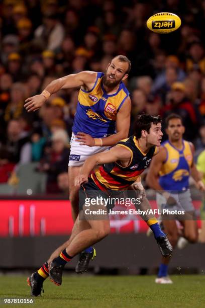Will Schofield of the Eagles tackles Darcy Fogarty of the Crows during the 2018 AFL round15 match between the Adelaide Crows and the West Coast...